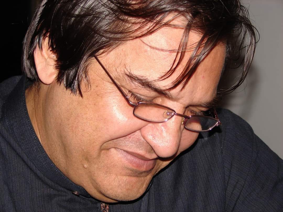 Ahmad Bilal in Hong Kong, 2009, looking down and smiling